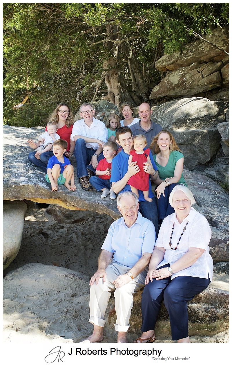 3 sisters and their families all together at the beach - family portrait photography sydney